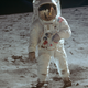 A famous photo of astronaut Buzz Aldrin walking on the lunar surface after disembarking from the Apollo 11 Lunar Module (LM) “Eagle”.